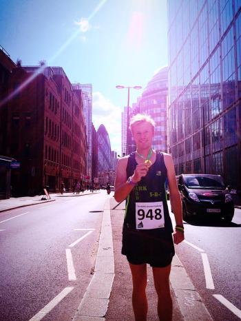 Beyond Human poses on London's Bishopsgate, with The Gherkin in the background